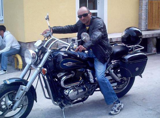 picture of the tattoo artist on his motorbike